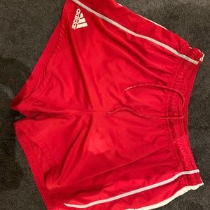 Red adidas training shorts